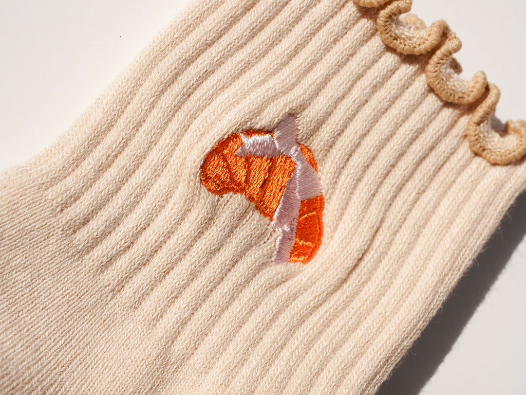 Close-up of Croissant Lover grip socks