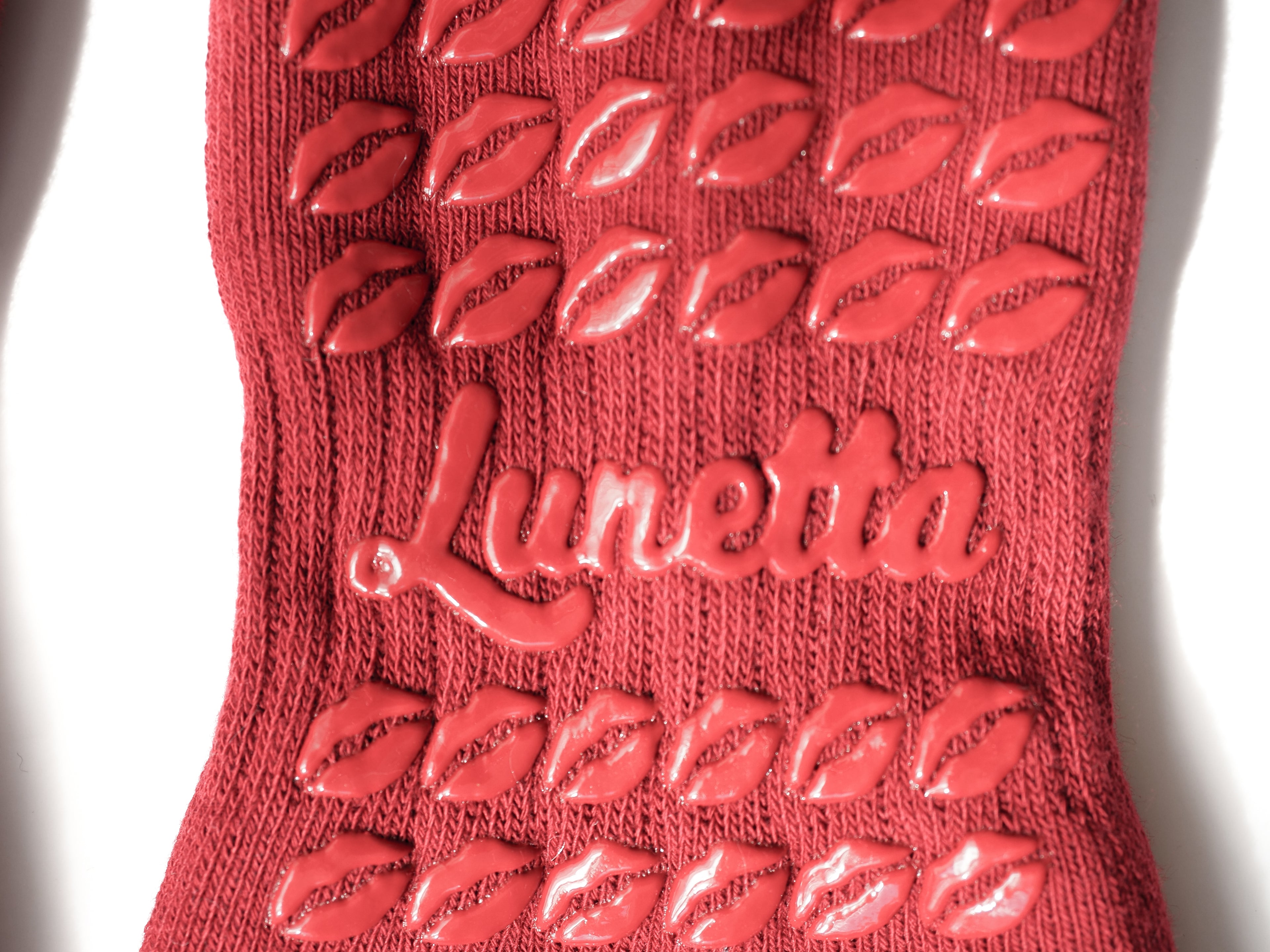 Close-up of the grips of Hot Mess socks