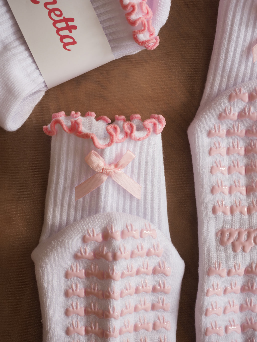 Close-up of Pink Ribbon grip socks